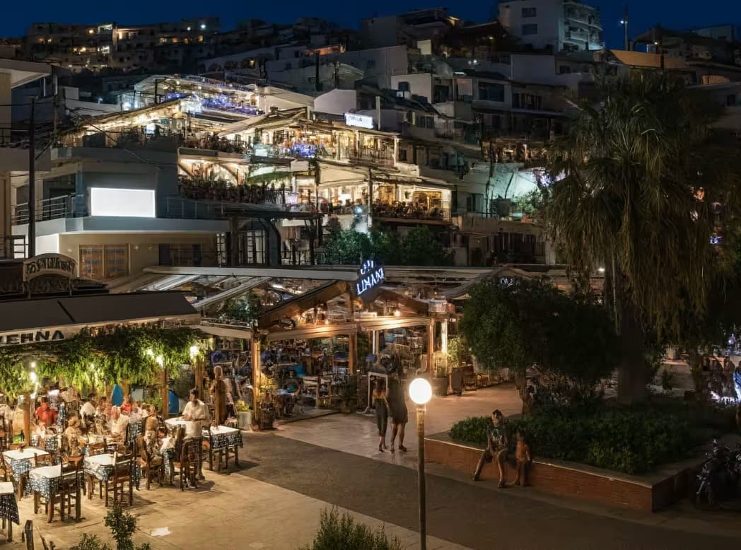 Panoramic view of the picturesque resort village of Agia Galini, South Crete, with harbor and traditional white houses built into the hillside
