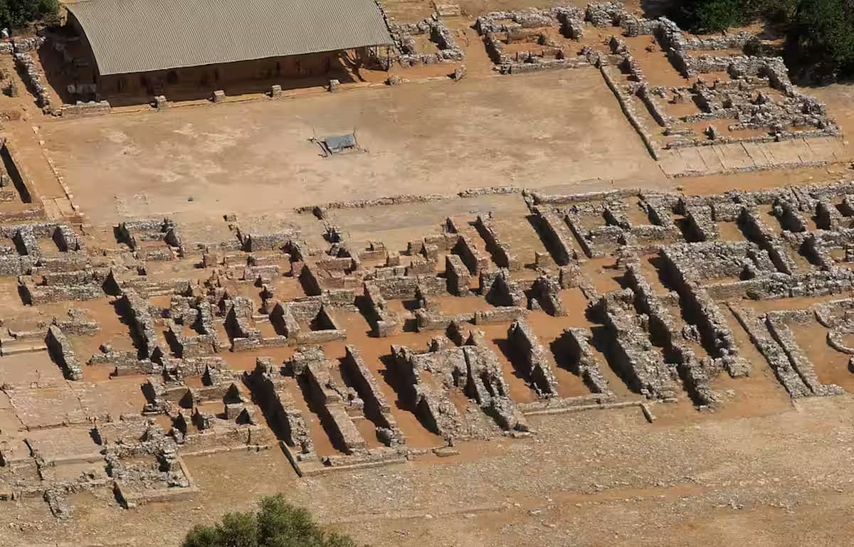 Aerial view of the extensive Minoan Palace of Malia archaeological ruins and foundations, East Crete, Greece